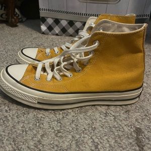 Yellow chuck taylor high top sneakers